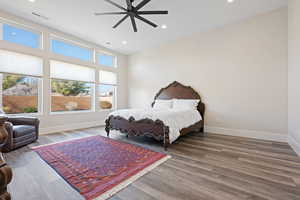 Bedroom featuring ceiling fan and hardwood / wood-style floors