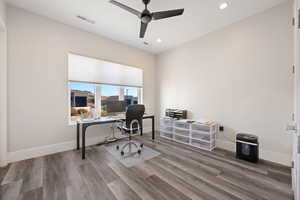 Office space featuring ceiling fan and hardwood / wood-style floors