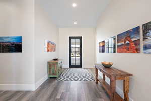 Foyer entrance featuring hardwood / wood-style floors