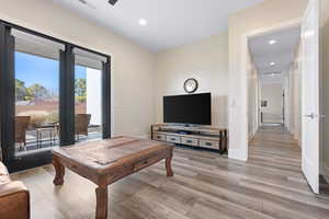 Living room with light hardwood / wood-style flooring