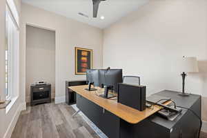 Office area featuring ceiling fan and wood-type flooring