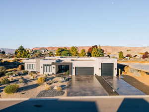 View of front facade with a mountain view and a garage