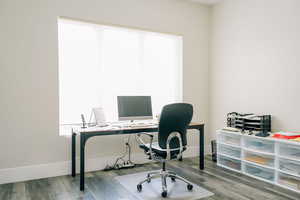 Home office featuring hardwood / wood-style floors