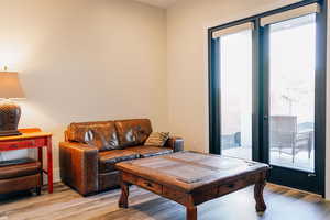 Living room with light hardwood / wood-style flooring