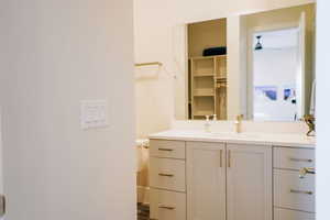 Bathroom featuring vanity and toilet