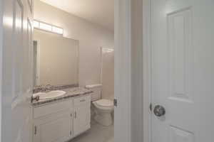 Bathroom featuring vanity and toilet