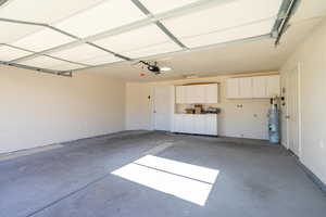 Garage featuring a garage door opener