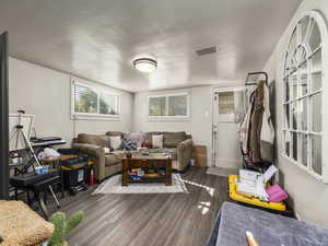 Living room featuring dark hardwood / wood-style flooring