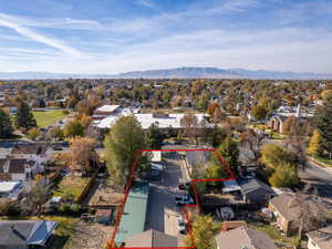 Birds eye view of property featuring a mountain view