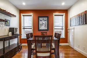 Dining space featuring a healthy amount of sunlight and light hardwood / wood-style floors