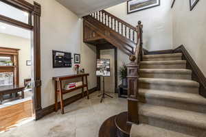 Stairway featuring wood-type flooring