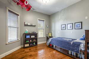 Bedroom with hardwood / wood-style floors