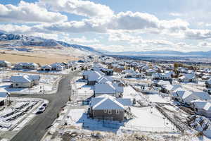 Snowy aerial view featuring a mountain view