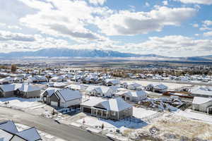 Snowy aerial view featuring a mountain view