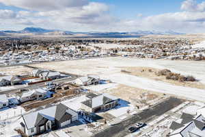 Snowy aerial view with a mountain view