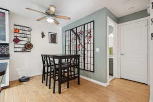 Dining area featuring light hardwood / wood-style flooring and ceiling fan