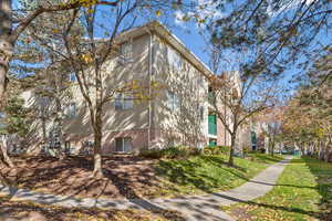 View of property exterior featuring a yard