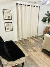 Bedroom with ceiling fan and wood-type flooring