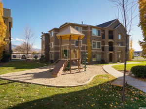 View of playground featuring a yard