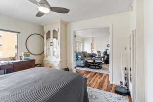 Bedroom with hardwood / wood-style flooring and ceiling fan