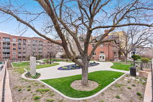 View of home's community with a lawn