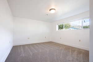 View of carpeted spare room