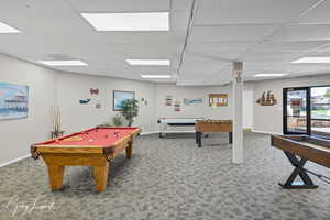 Clubhouse - Rec room with a drop ceiling, carpet floors, and pool table