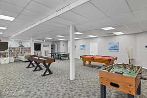 Clubhouse - Game room with carpet, a drop ceiling, and pool table