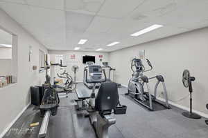 Gym with a paneled ceiling