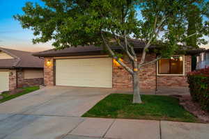 View of front of property featuring a garage