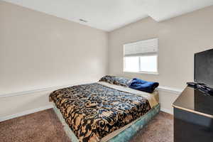 Bedroom featuring carpet