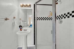 Bathroom featuring tile patterned floors and walk in shower