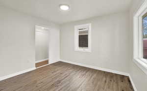 Unfurnished bedroom with hardwood / wood-style flooring and a closet