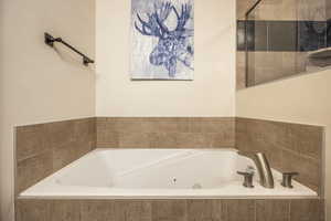 Bathroom with a relaxing tiled tub