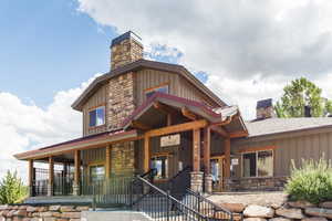 Rear view of property with a porch