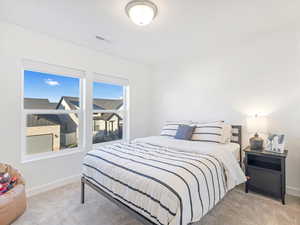 View of carpeted bedroom