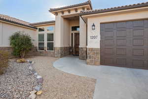 Entrance to property with a garage