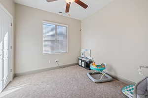 Miscellaneous room with carpet flooring, ceiling fan, and vaulted ceiling