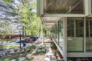 View of side of home featuring a patio area