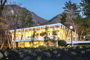 Rear view of property with a mountain view