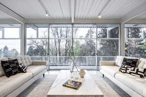 Sunroom featuring plenty of natural light