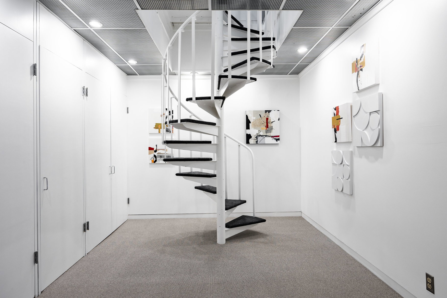 Interior space featuring light colored carpet