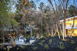 View of yard featuring a patio area and a fire pit