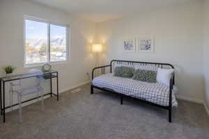 Bedroom featuring a mountain view and carpet floors