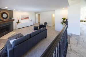 Living room with light colored carpet and crown molding