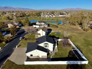 Birds eye view of property featuring a water and mountain view