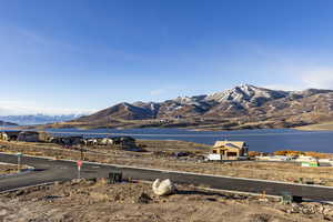 Property view of mountains with a water view