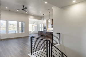 Interior space featuring hardwood / wood-style flooring, ceiling fan, and sink