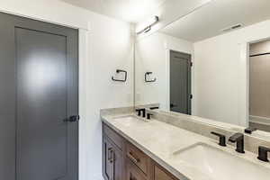 Bathroom with vanity and a textured ceiling