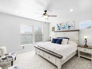 Master Bedroom. Carpeted bedroom featuring multiple windows and ceiling fan